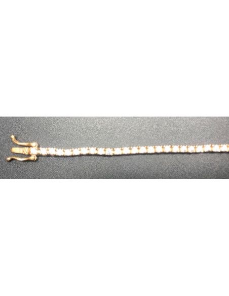 Pulsera fina dorada con circonitas redondas