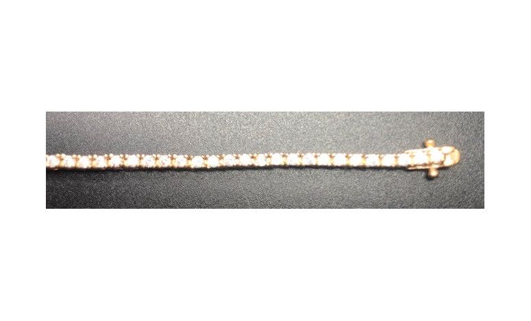 Pulsera fina dorada con circonitas redondas