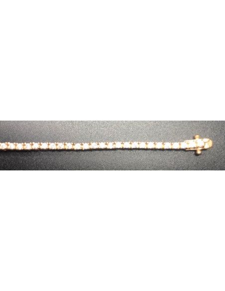Pulsera fina dorada con circonitas redondas