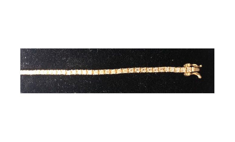 Pulsera fina dorada con circonitas redondas