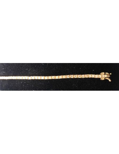 Pulsera fina dorada con circonitas redondas